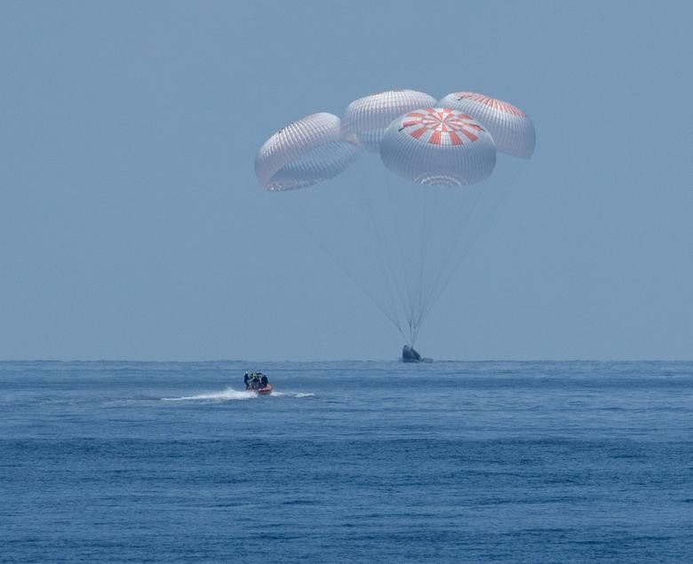The SpaceX Crew Dragon Endeavour spacecraft is seen as it lands with NASA astronauts Robert Behnken and Douglas Hurley on board in the Gulf of Mexico off the coast of Pensacola, Florida, August 2. NASA/Bill Ingalls/Handout via REUTERS